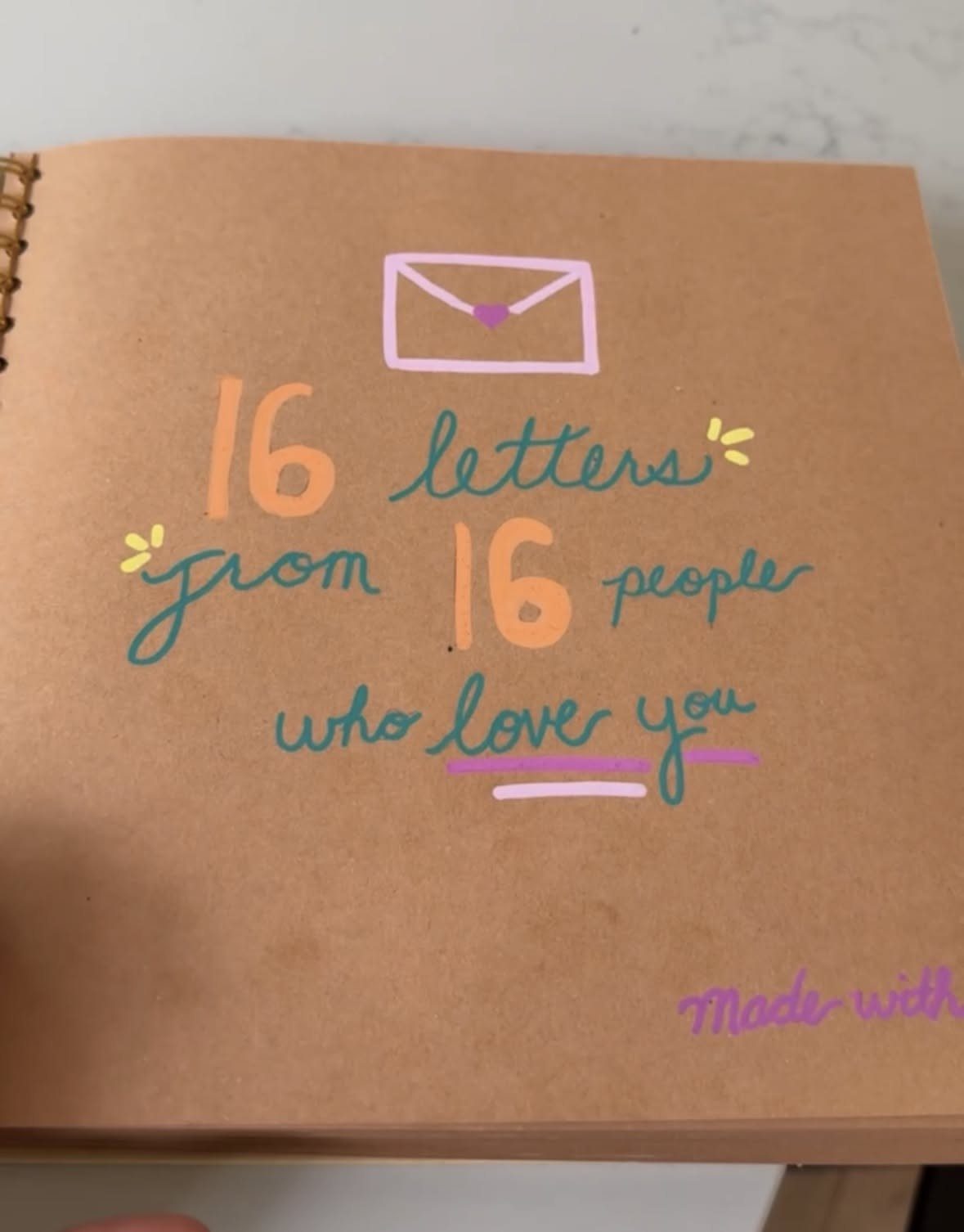 Brown kraft paper book cover with hand-lettered text about sixteen letters of love.