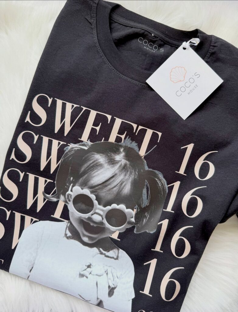 Black t-shirt with Sweet 16 text and a girl's graphic on white fur