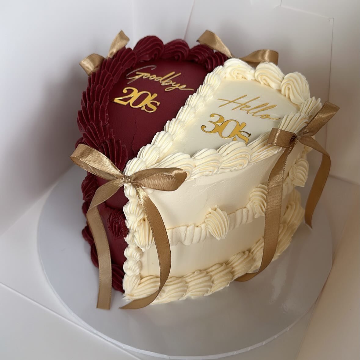 Heart-shaped cake split red and white with gold text marking a 30th birthday.
