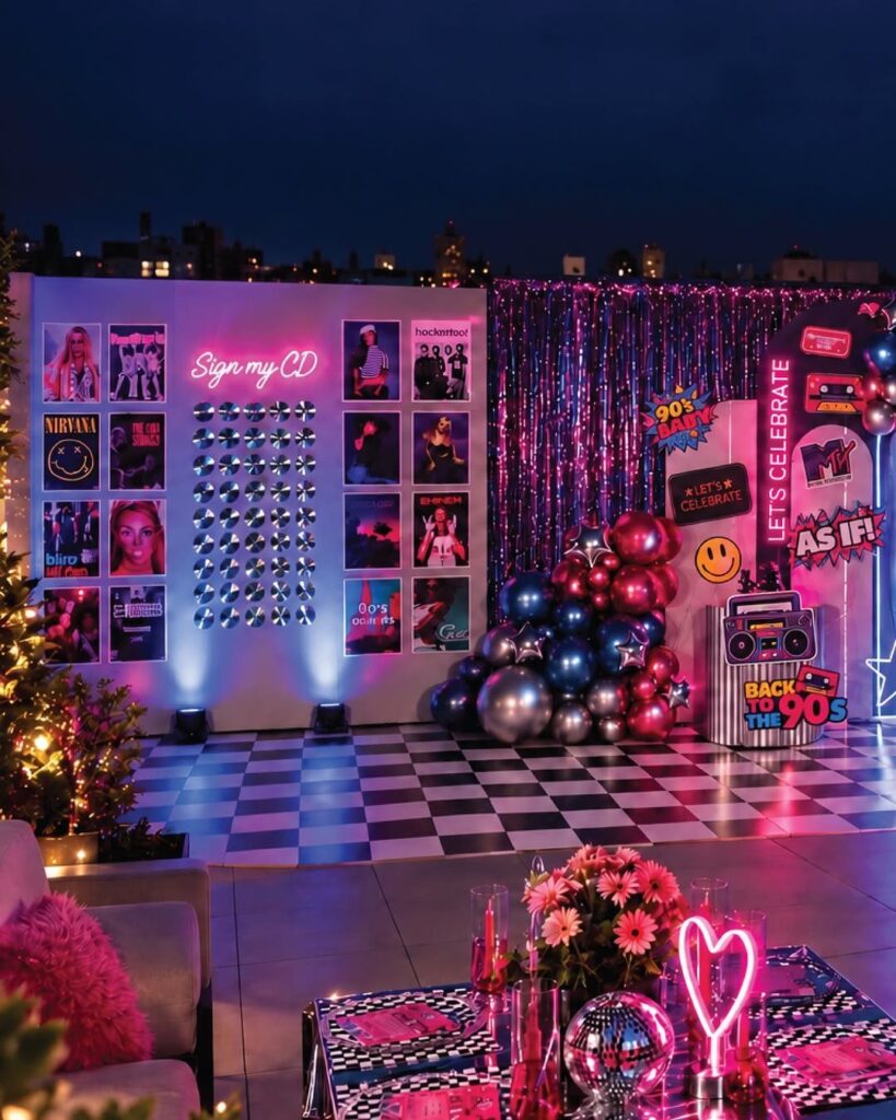 90s throwback party setup with neon lights, CD wall, and boombox prop.