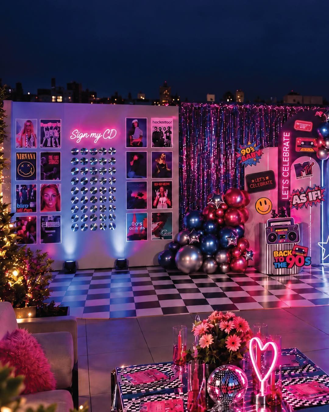 90s throwback party setup with neon lights, CD wall, and boombox prop.