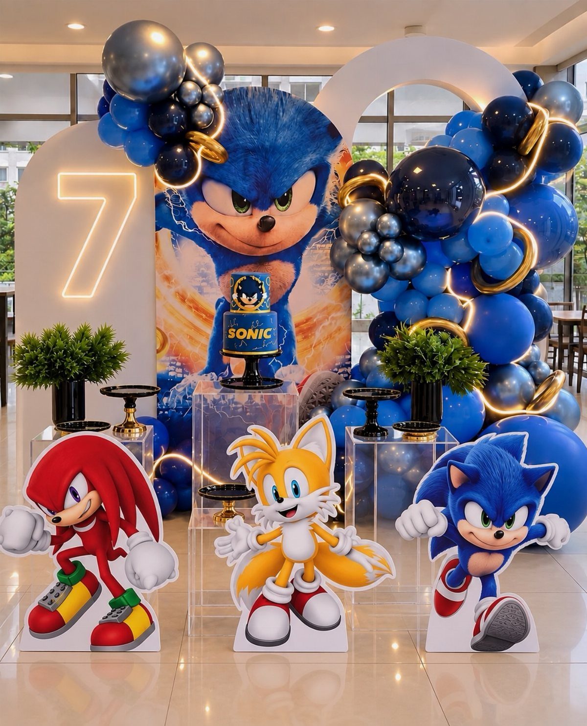 Sonic the Hedgehog birthday party decorations with blue balloons and character cutouts.